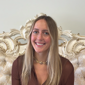 A woman is examining a man 's head in a lab