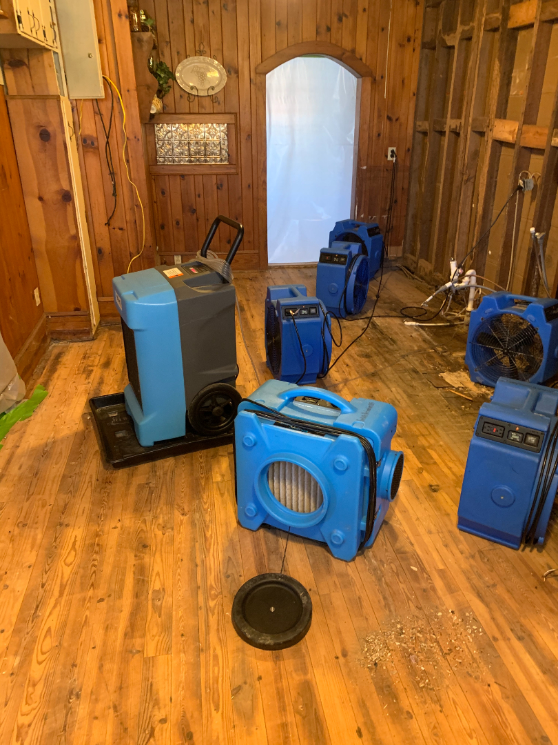 Residential interior water damage restoration using professional drying equipment by Foothills Construction and Restoration Services, phone (828) 600-5227.