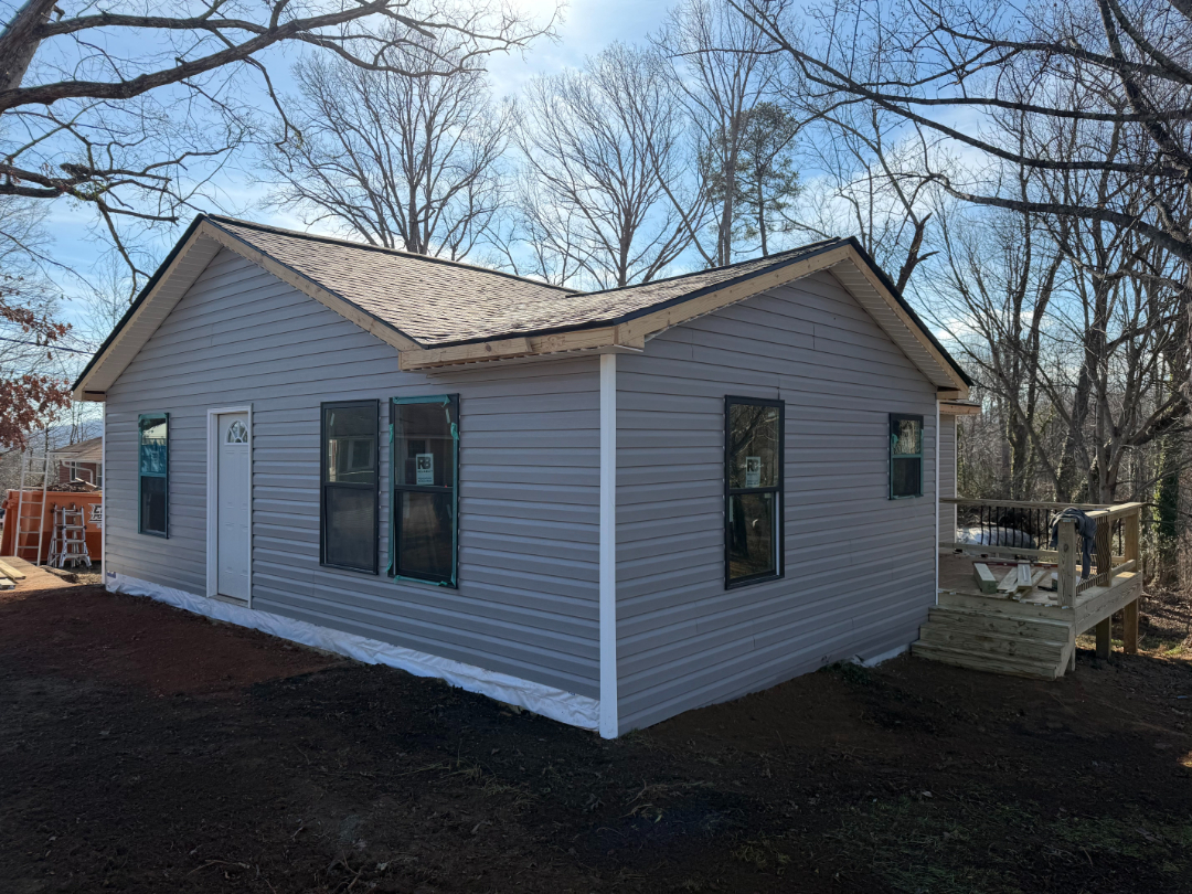 Exterior view of a residential home after restoration work by Foothills Construction and Restoration Services in Morganton, North Carolina. Phone (828) 373-1194.