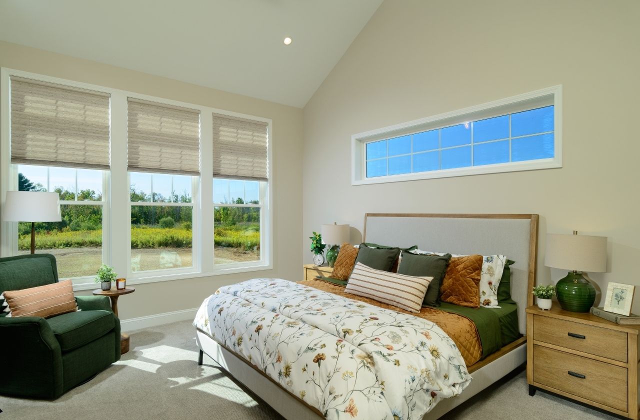 18 Dahlia Drive - Lincoln Ranch - Primary Bedroom featuring large windows with transoms above for additional light