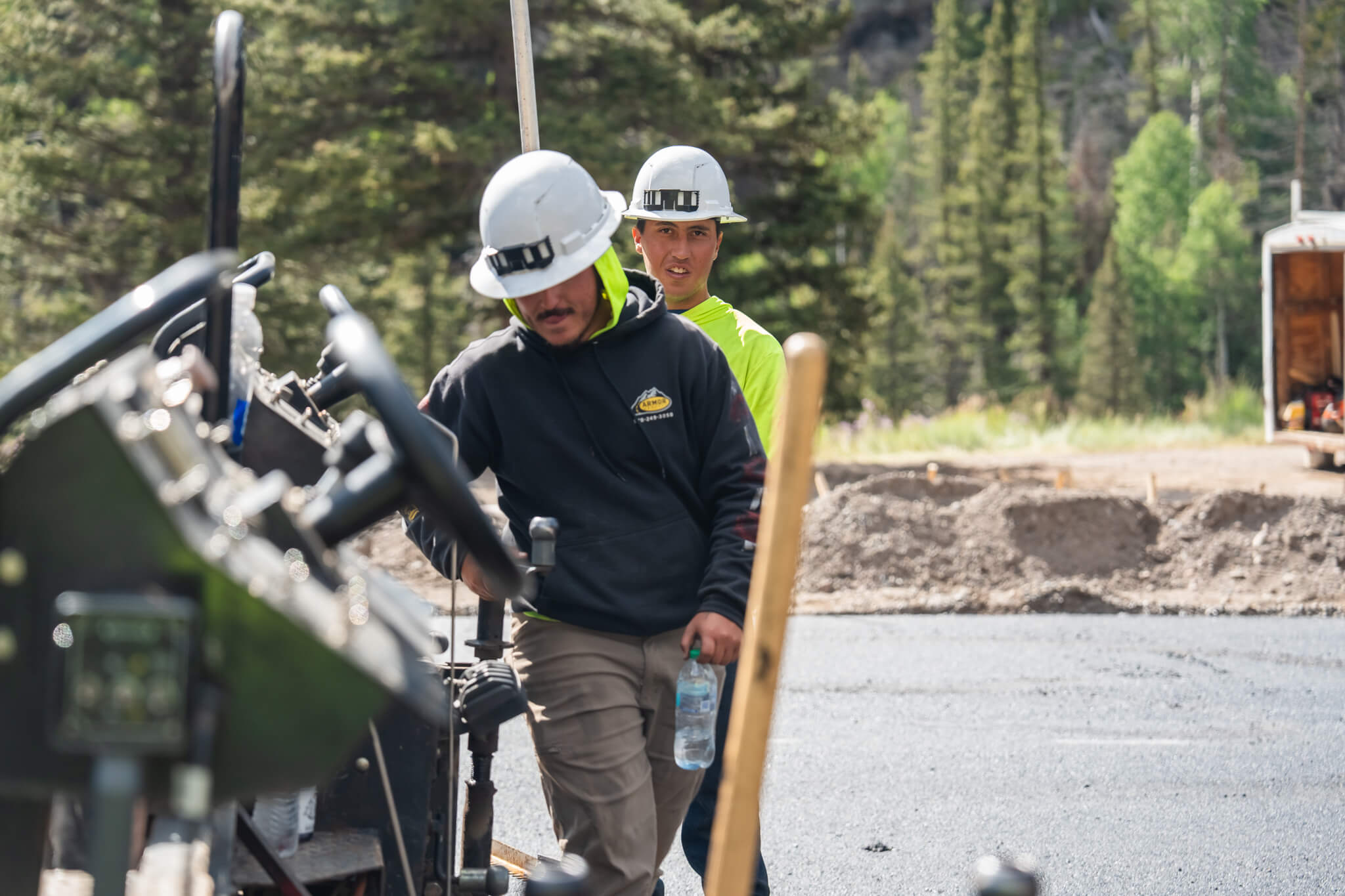 Rural road repair and maintenance in Hotchkiss, CO, with Armor Proseal equipment addressing weather damage and extending pavement life in agricultural community settings.
