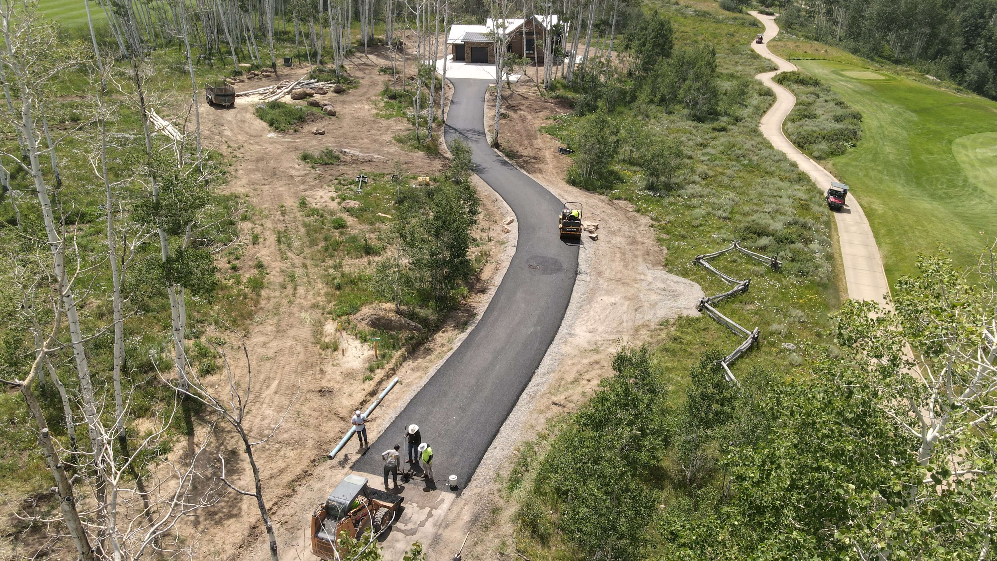 Residential subdivision infrastructure in Parachute, CO, with Armor Proseal crews installing new roadways that enhance community development with quality asphalt surfaces.