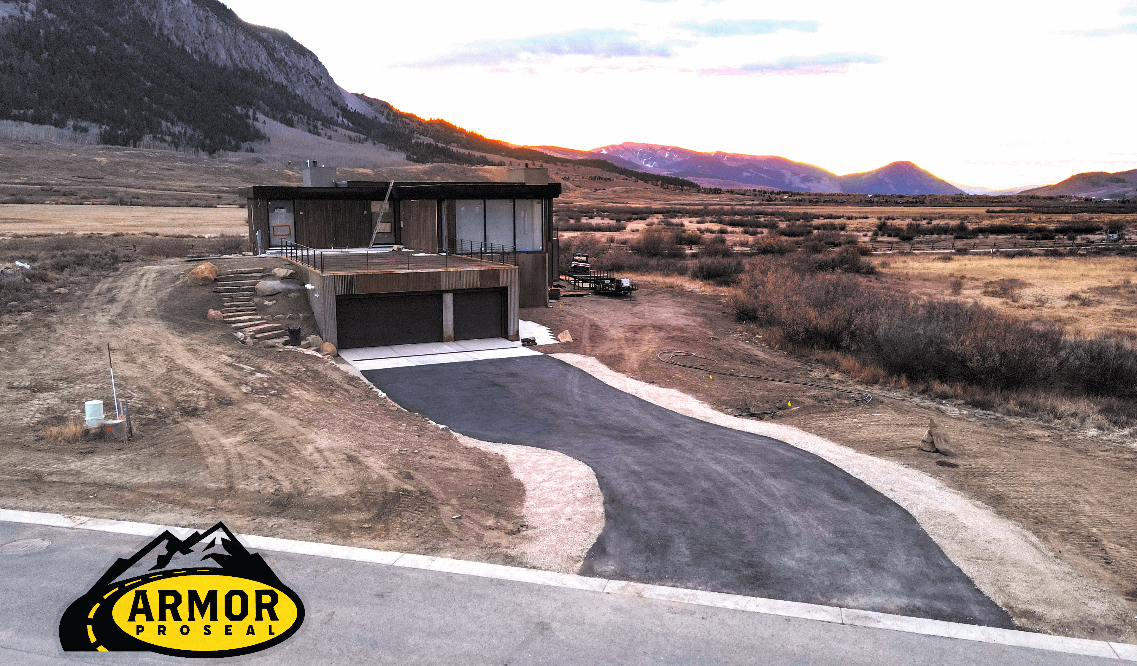 Armor Proseal crew performing precision asphalt repairs on a municipal roadway in Rifle, CO, extending pavement life and improving safety with professional-grade equipment and techniques.