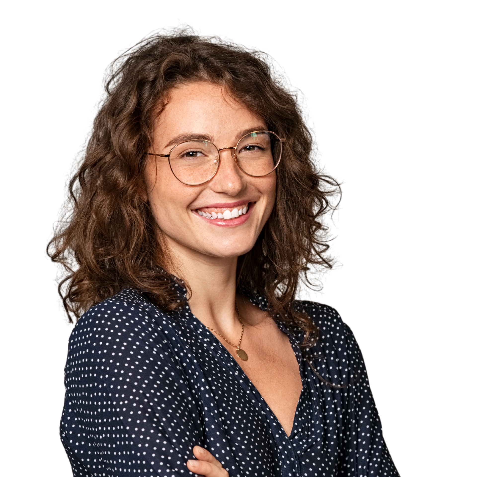 A woman with long hair is smiling with her hands on her face.