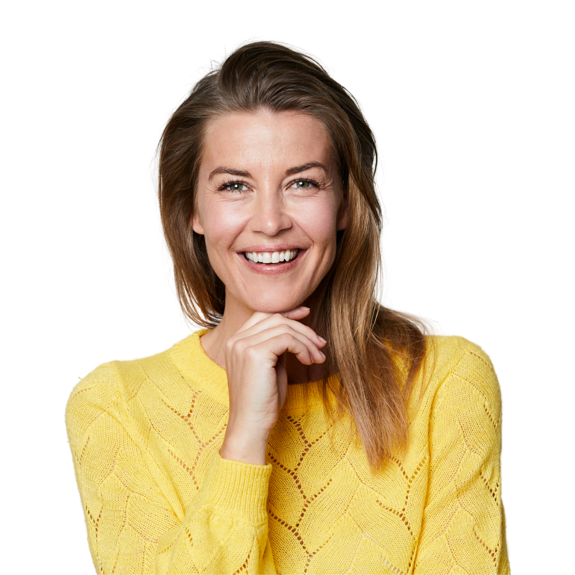 A woman with long hair is smiling with her hands on her face.