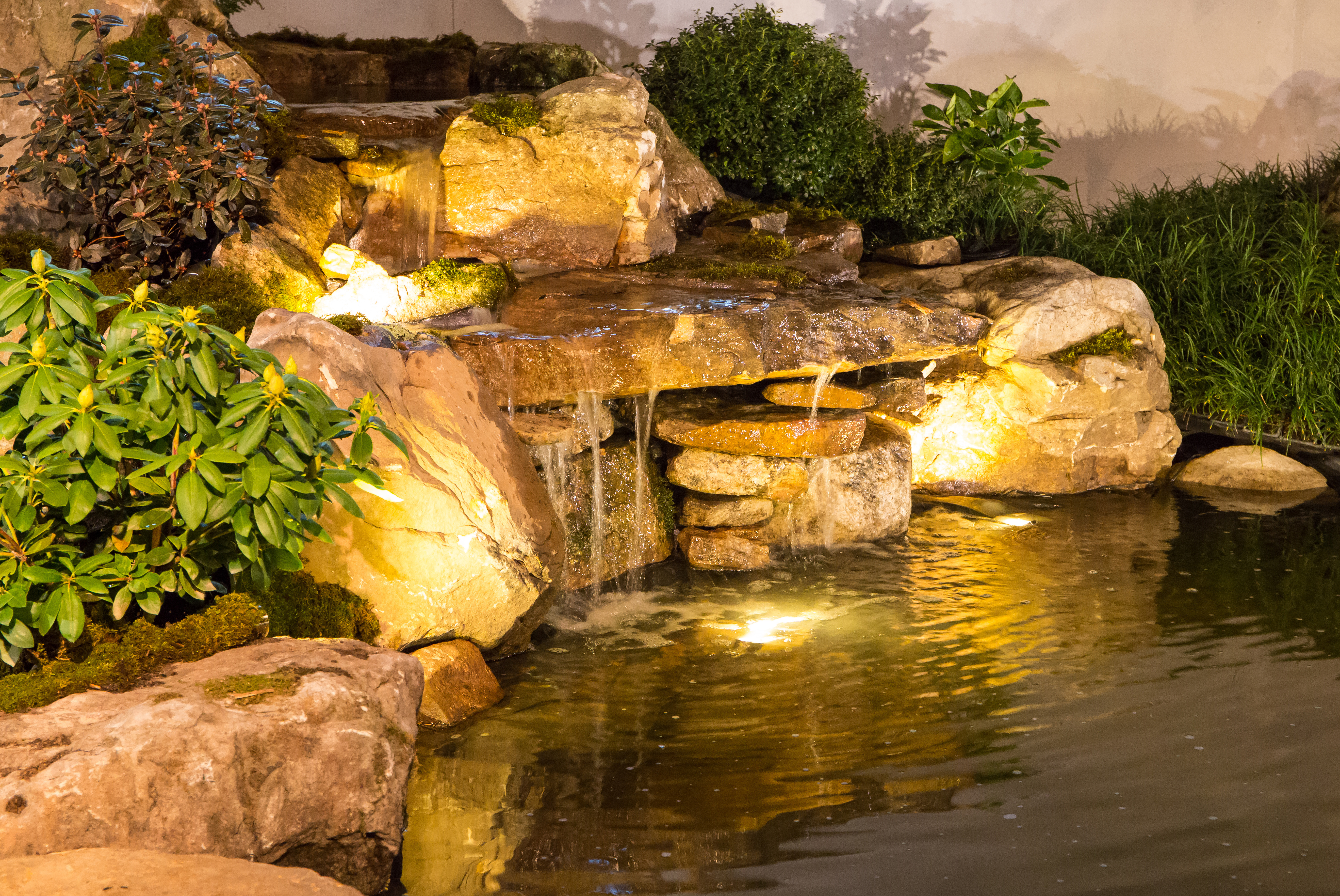 Rock waterfall water feature installation by Alpine Property Services in Western Colorado