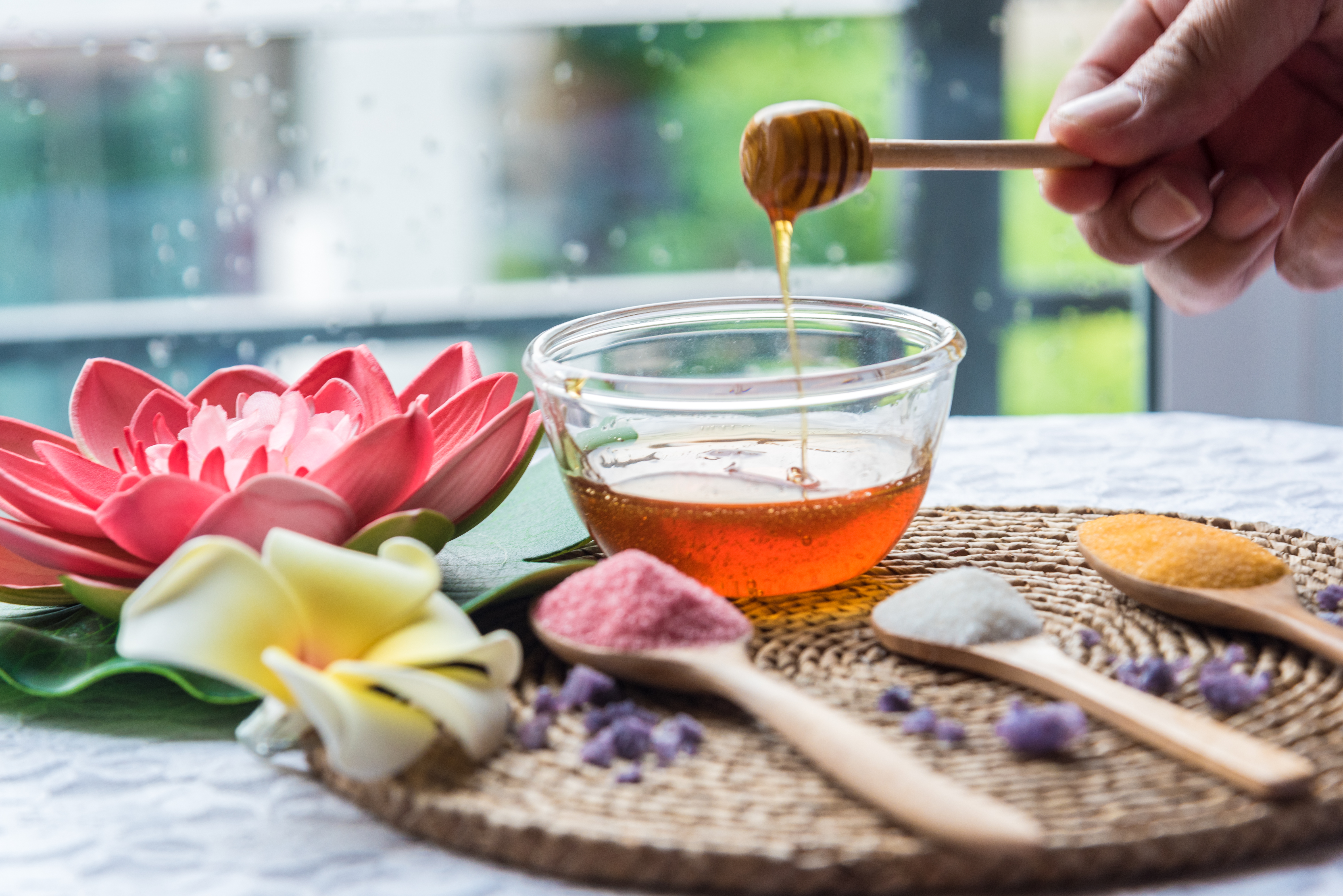 cropped-hand-holding-honey-dipper-spa.jpg
