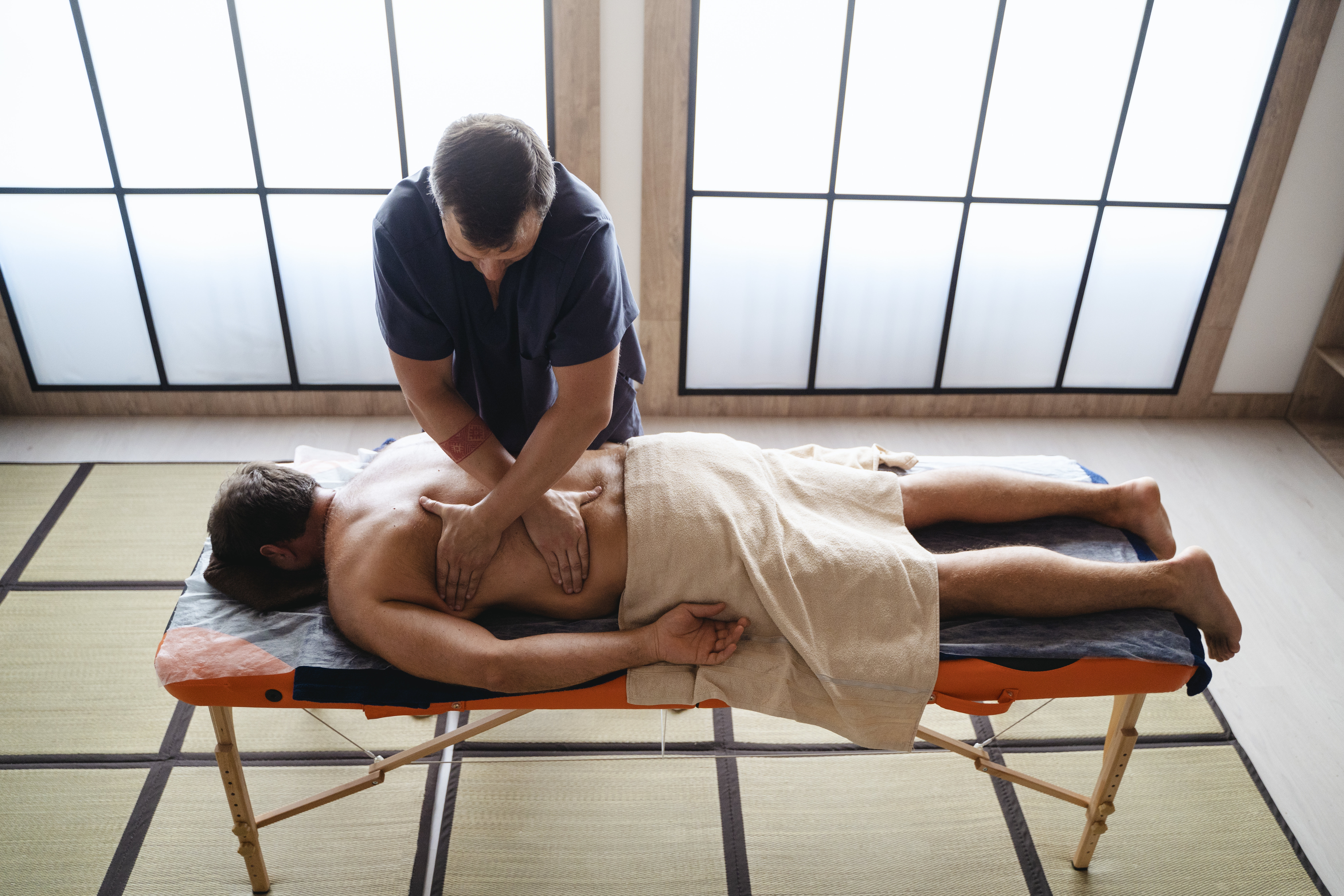 high-angle-man-getting-massage.jpg
