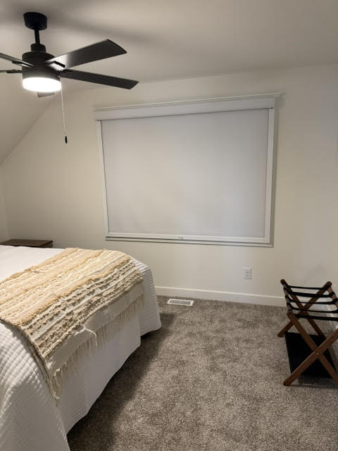 Roller shades installed in a bedroom by Simmonds Blinds and Drapes in Bowling Green, KY. Call (270) 514-4492.