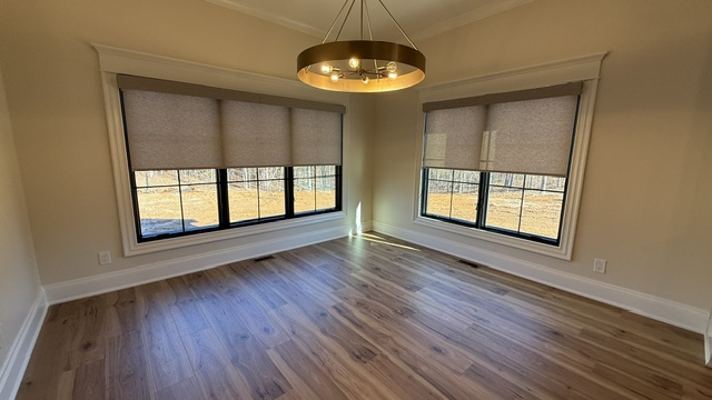 Roller shades in a dining room installed by Simmonds Blinds and Drapes in Bowling Green, KY. Call (270) 514-4492.