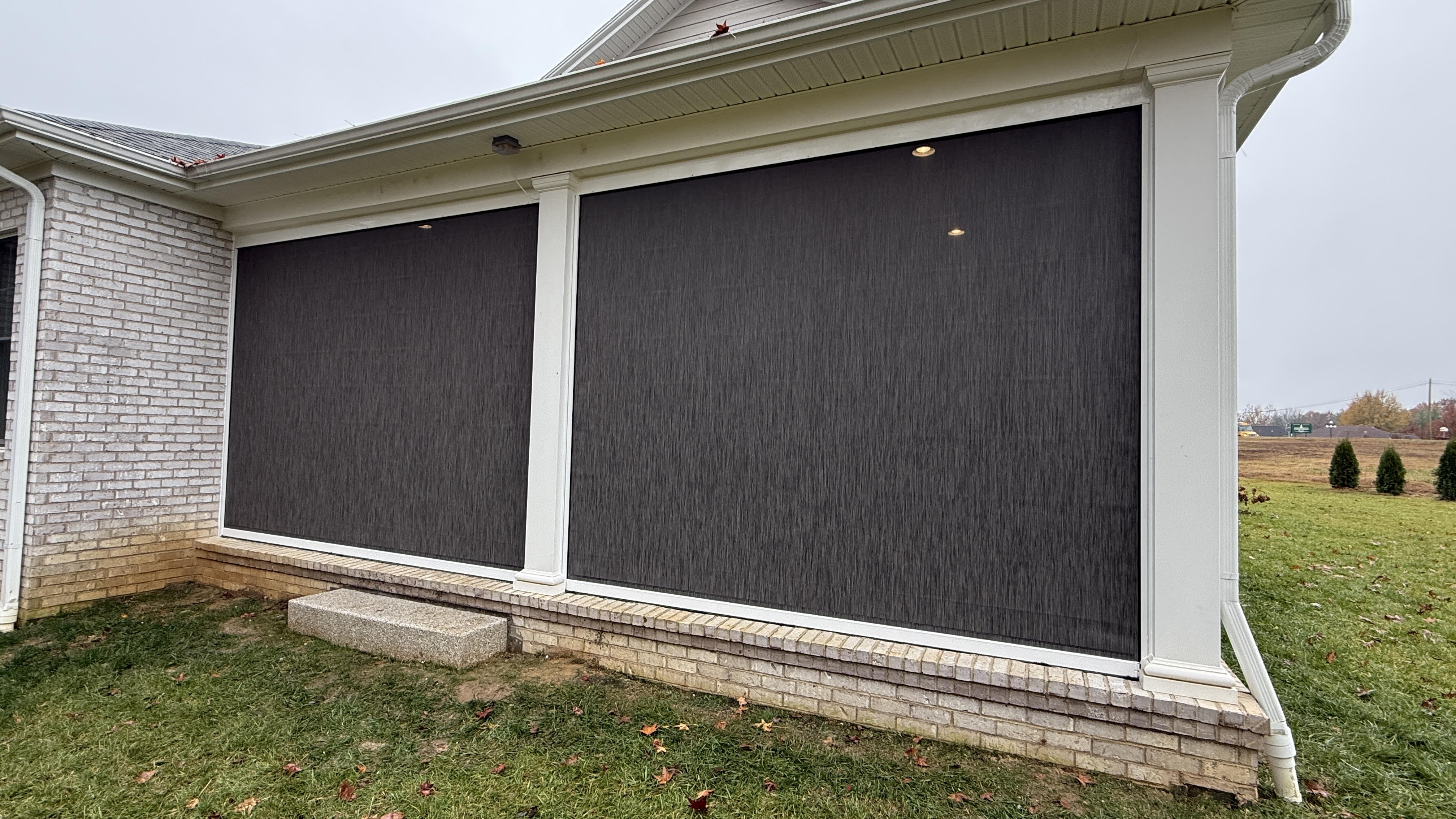 Exterior patio shades installed in Owensboro, KY by Simmonds Blinds and Drapes for sun and privacy control. Call (270) 477-3071 today.