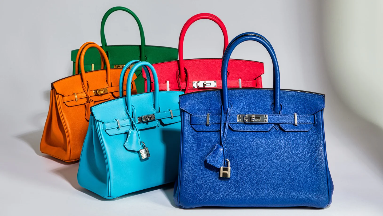 A row of multi-coloured Hermès Birkins