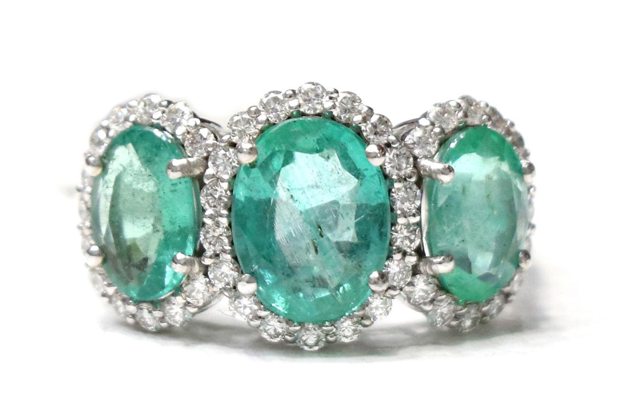 TRIPLE EMERALD DIAMOND HALO RING