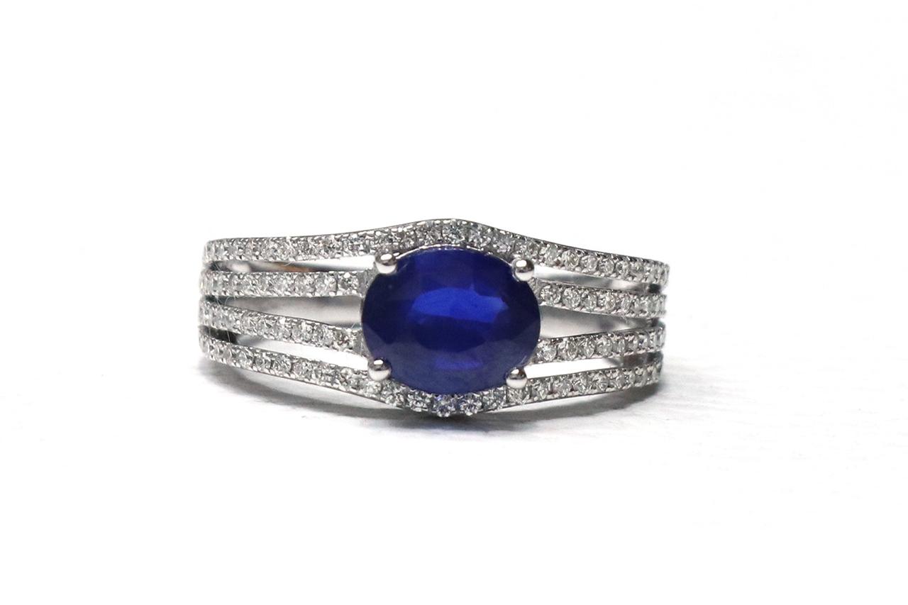 EAST WEST BLUE SAPPHIRE ON STACKED DIAMOND BAND RING