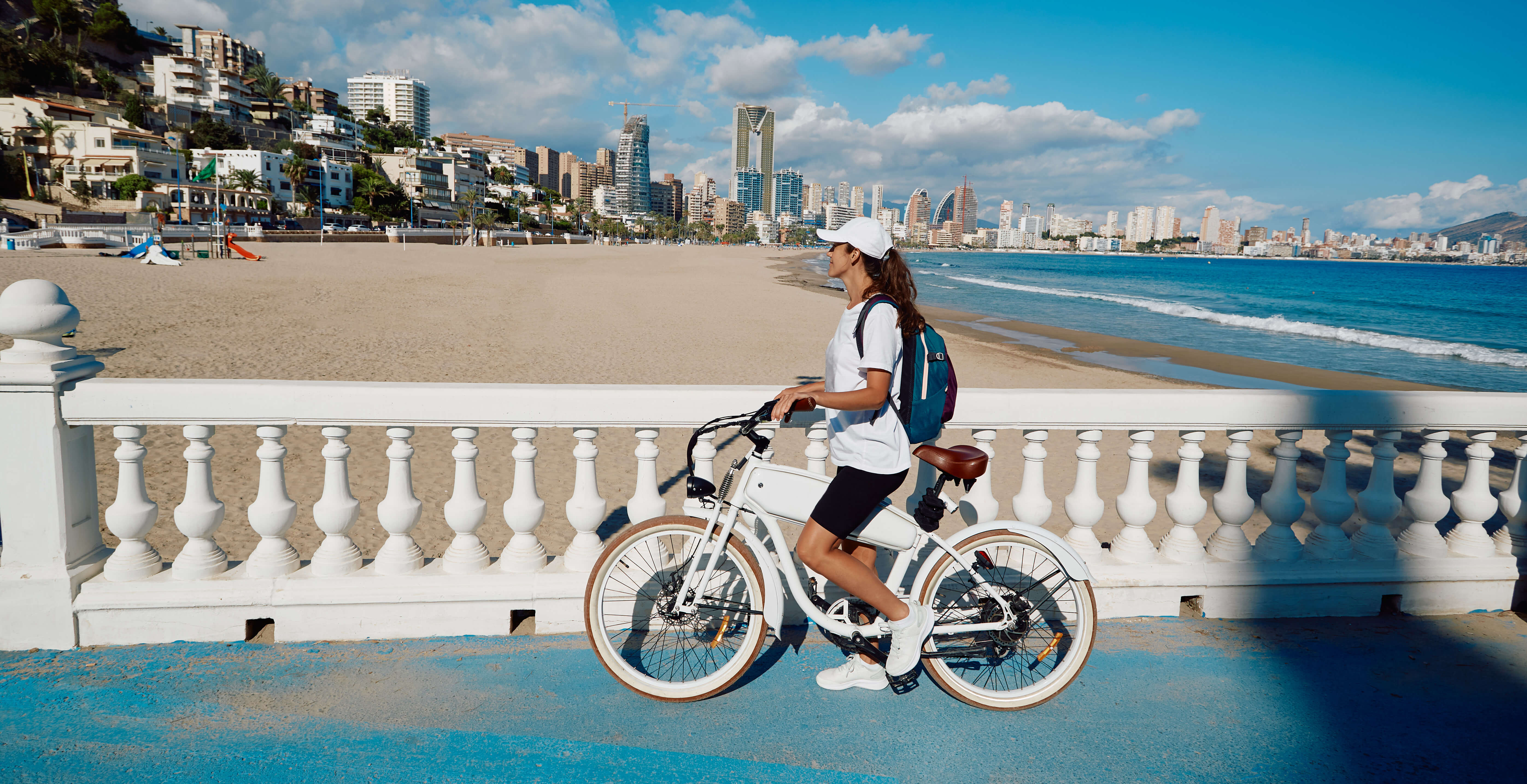 A young woman riding an e-bike