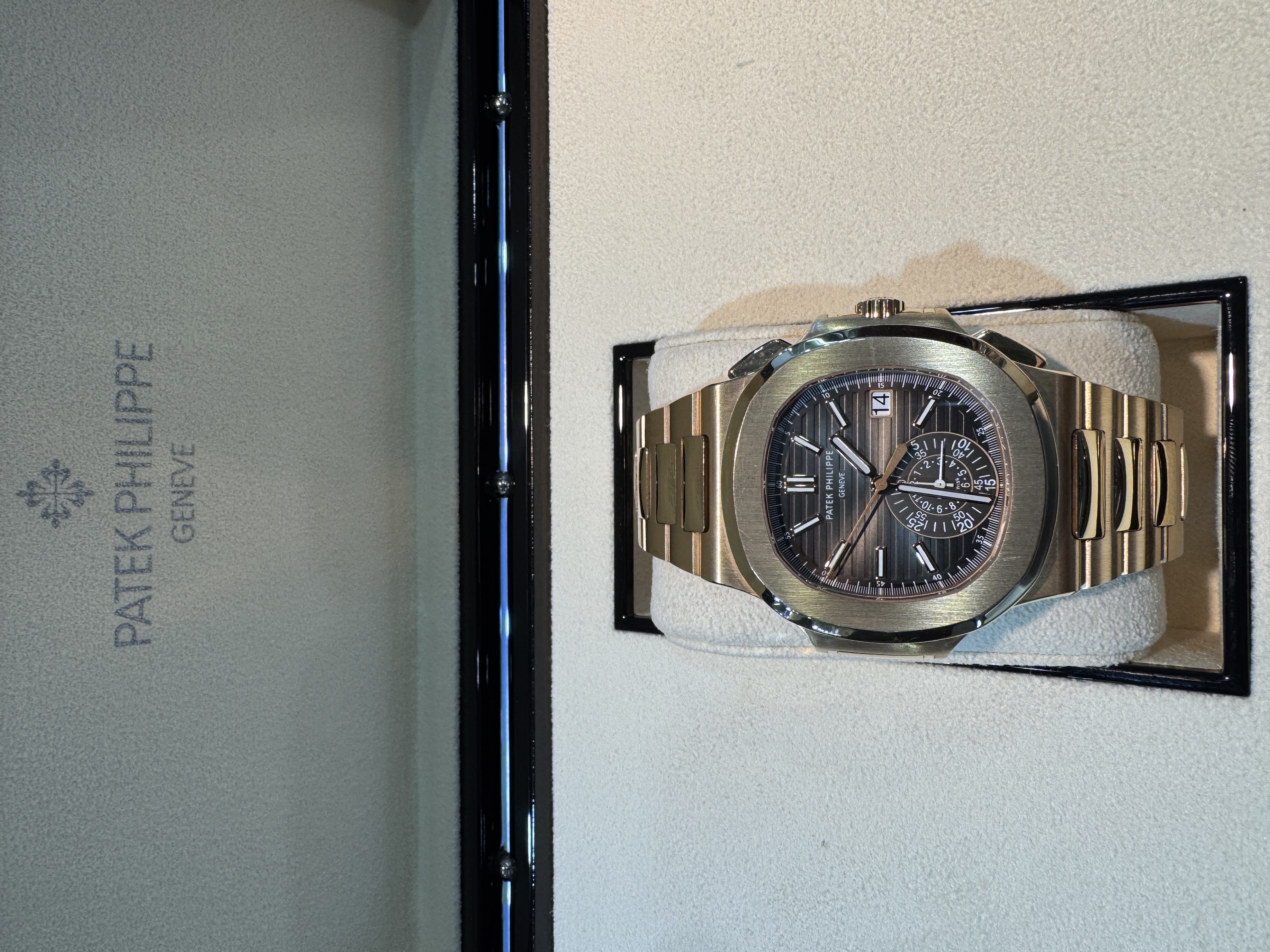 Patek Philippe Nautilus Ref. 5980/1R — Like New condition, authenticated by 13th Time