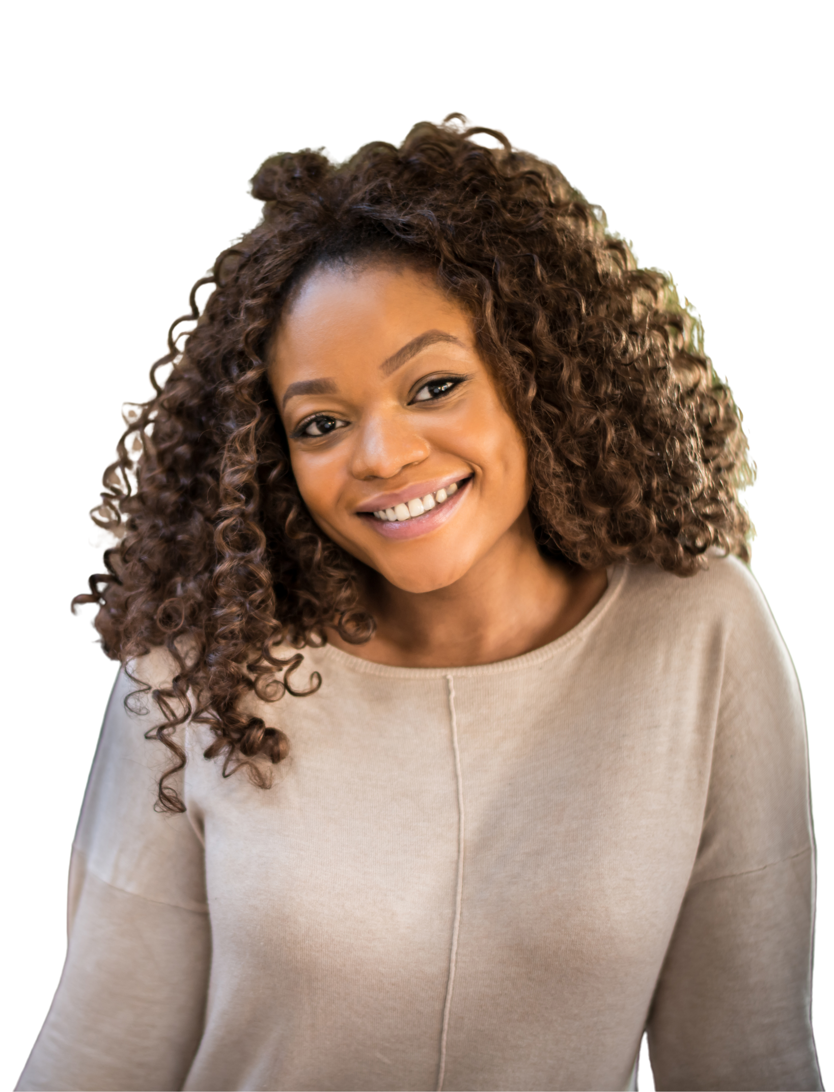 A woman in a white shirt is smiling with her hand on her chin