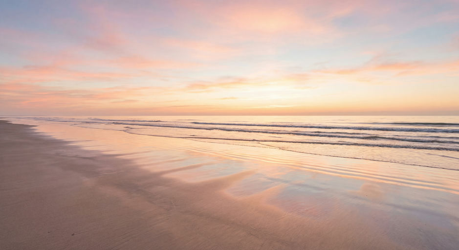 Vast Beach at Pastel Sunrise