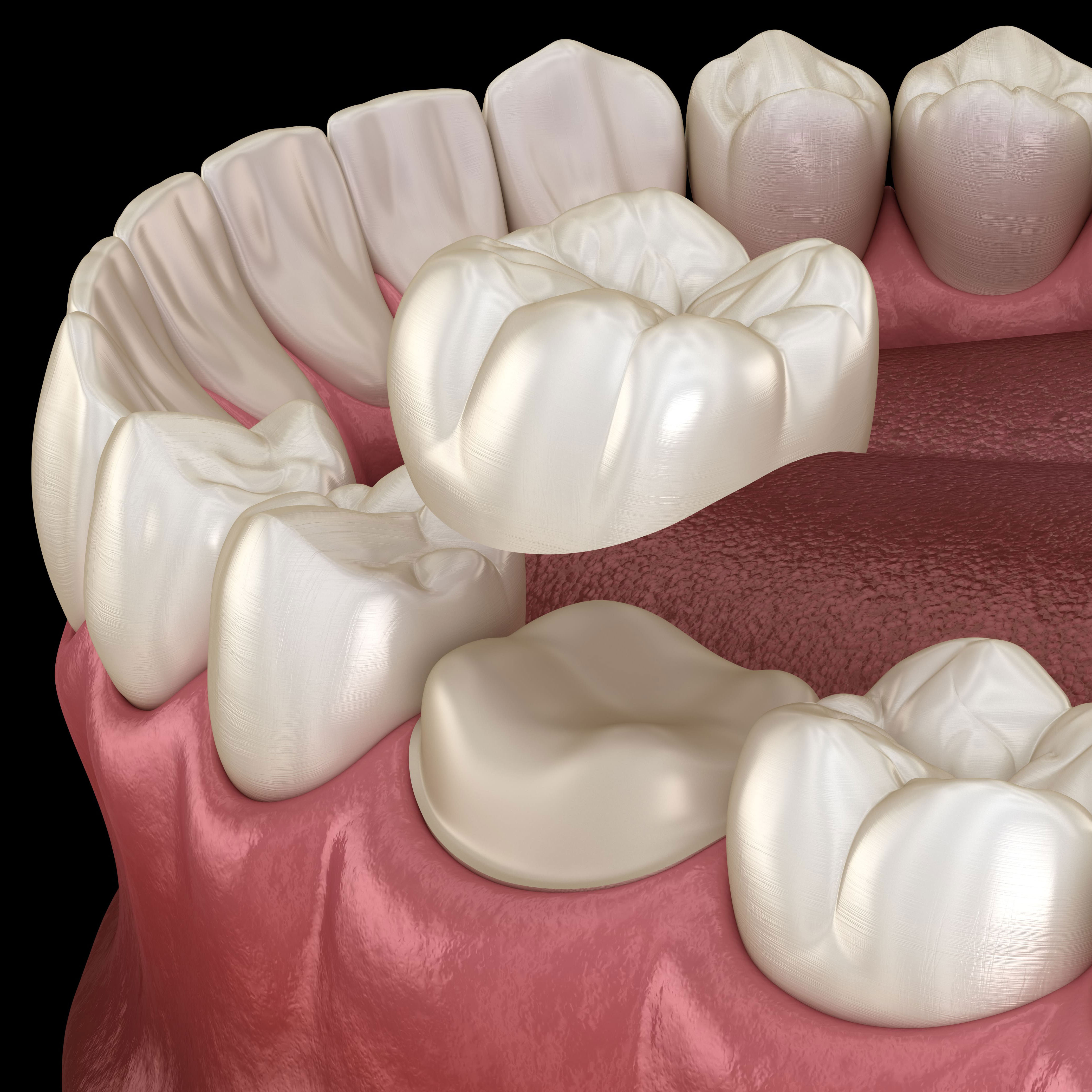 A man with a beard is wearing a white shirt and smiling with his arms crossed.