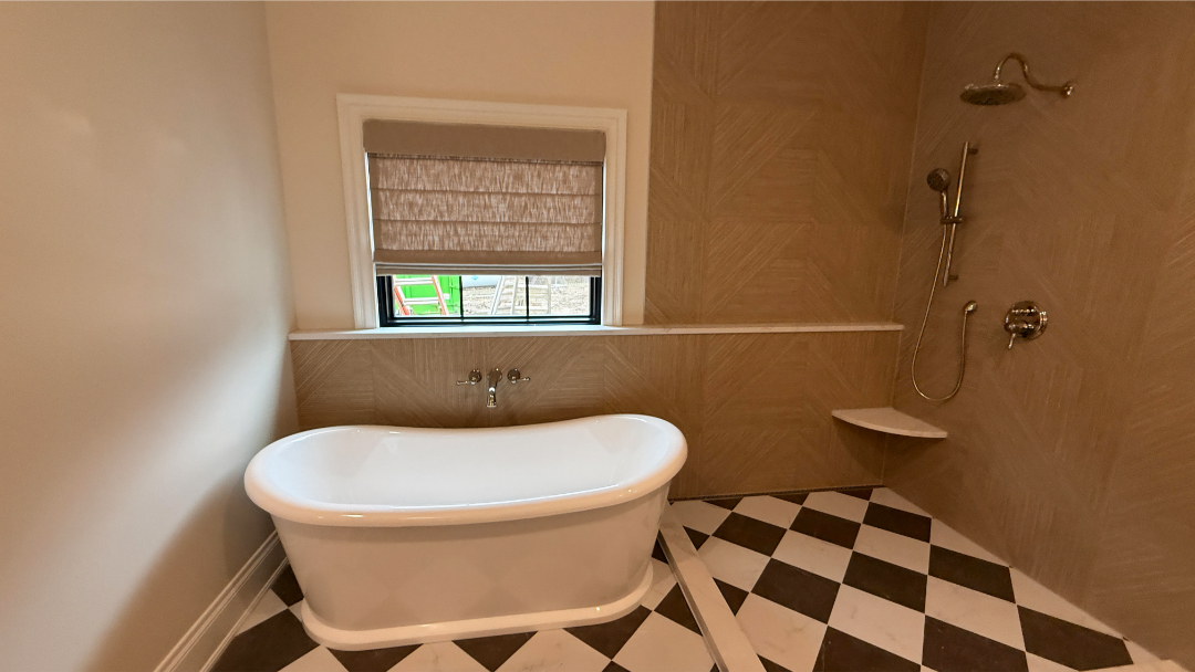 Custom Roman shades installed above a bathtub window by Simmonds Blinds and Drapes in Alvaton, KY. Call (270) 550-1334 for window treatments.