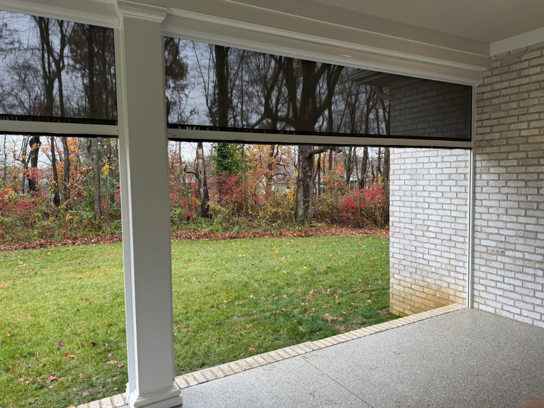 Exterior patio shades installed on a covered patio by Simmonds Blinds and Drapes serving Alvaton, KY. Call (270) 550-1334 for outdoor shades.