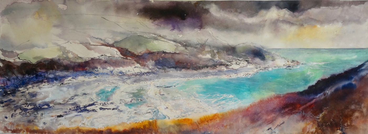 Looking Down into the bay, a couple walk along the coastal path, with bright cerulean blue sea. Cornwall