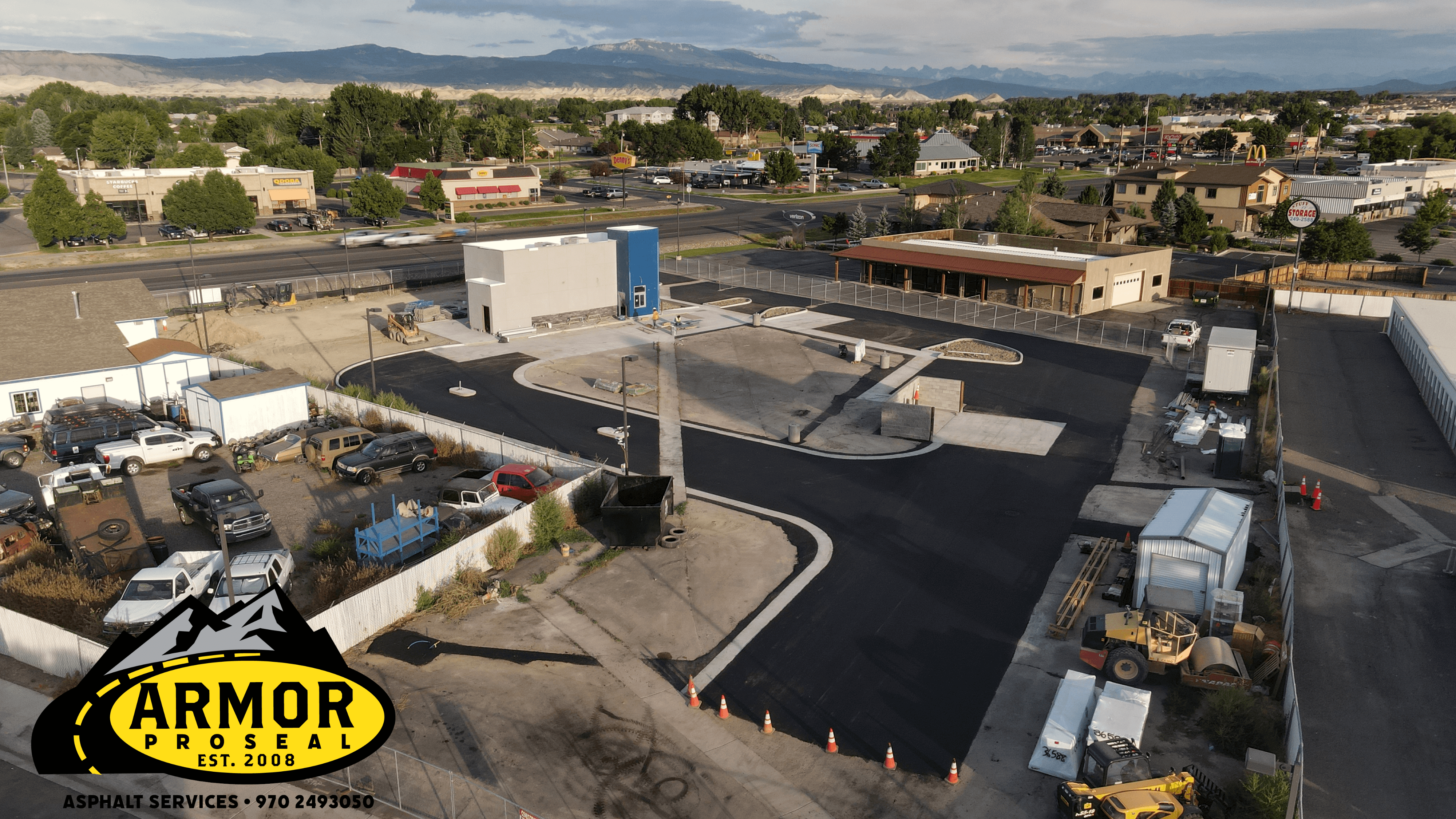 Municipal facility asphalt paving project in Durango, CO, with Armor Proseal crew using commercial-grade equipment to create durable surfaces that withstand seasonal temperature variations.