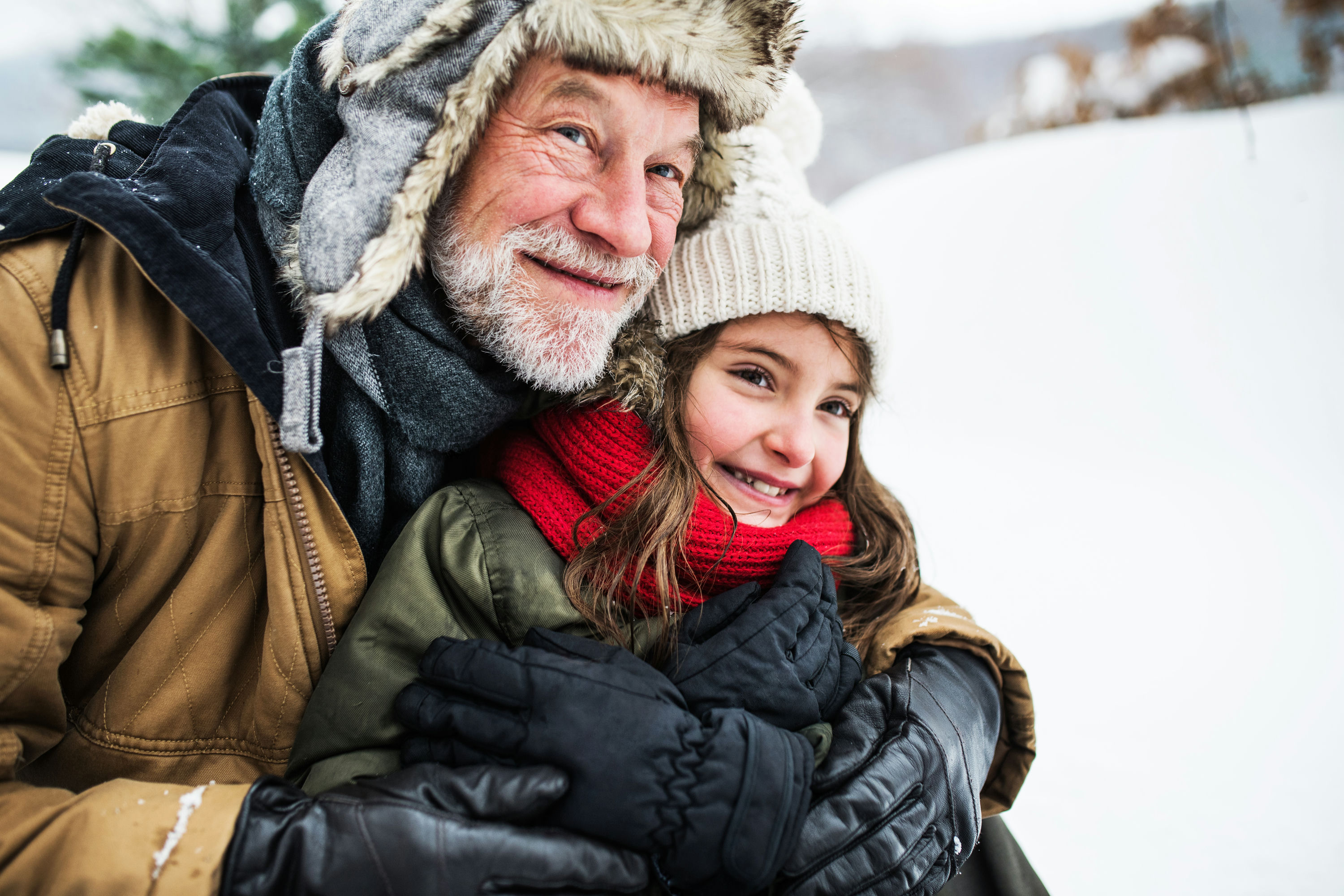Man with kid in snow